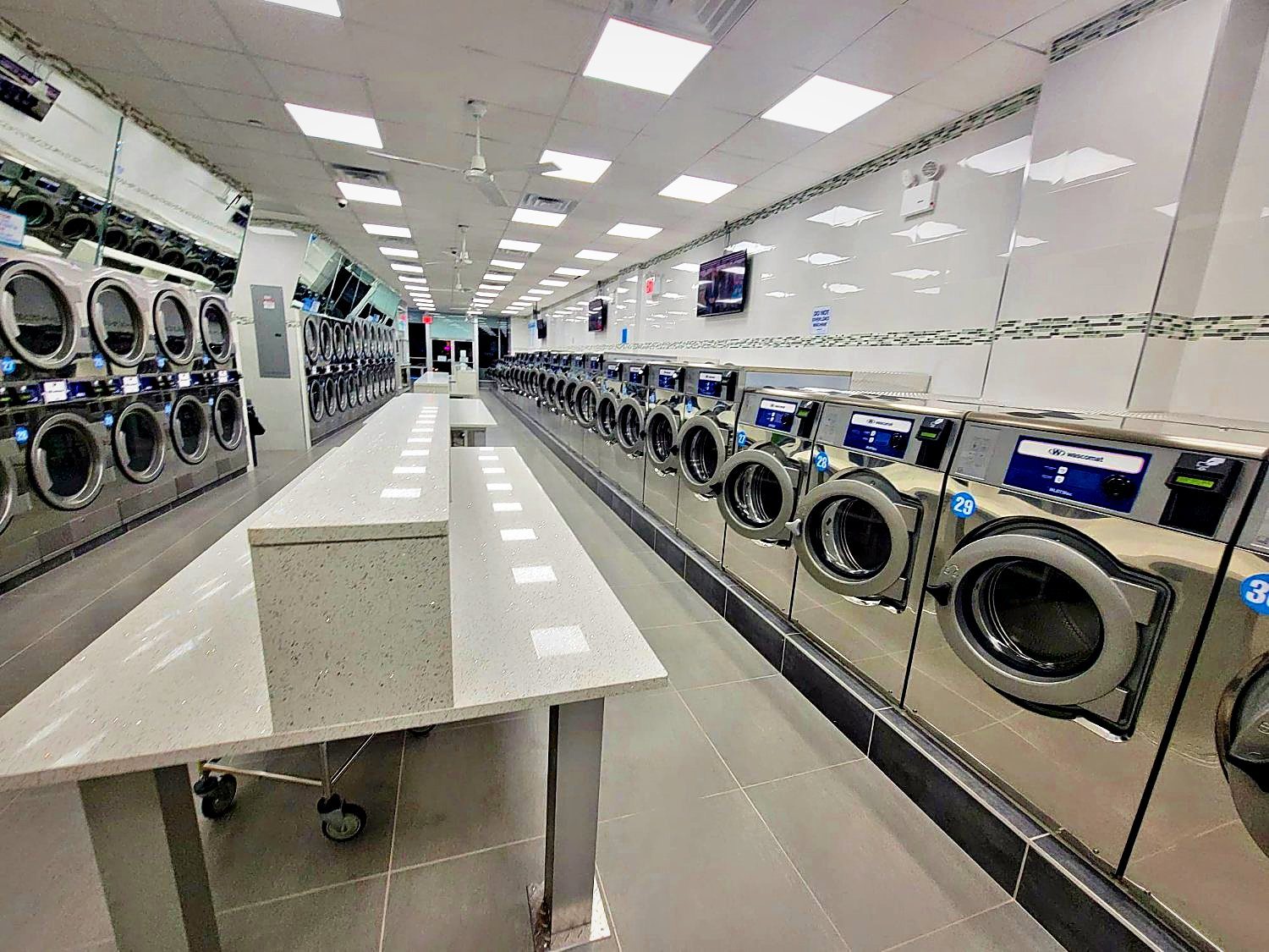 A long row of large front-load washers