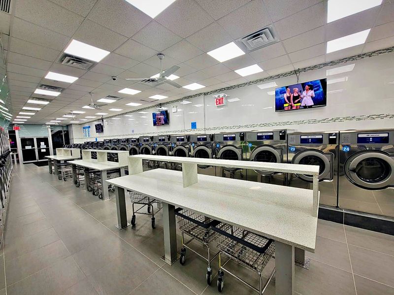 Long folding tables with laundry carts